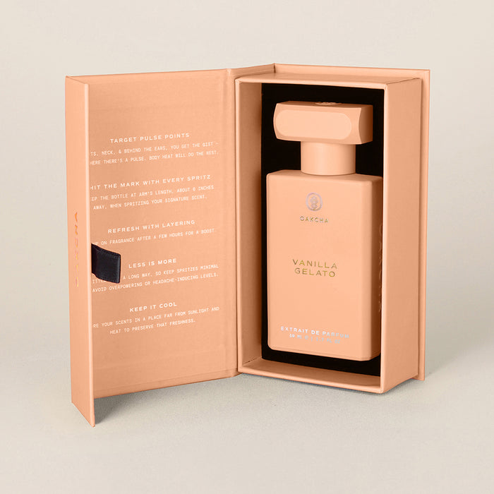 Front view of Vanilla Gelato perfume bottle in open peach presentation box showing rectangular bottle with matching cap and printed inner panel