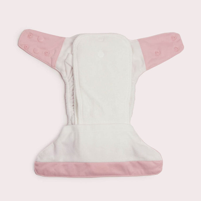 Cloth nappy laid flat on a surface showing inserts, tucked in.