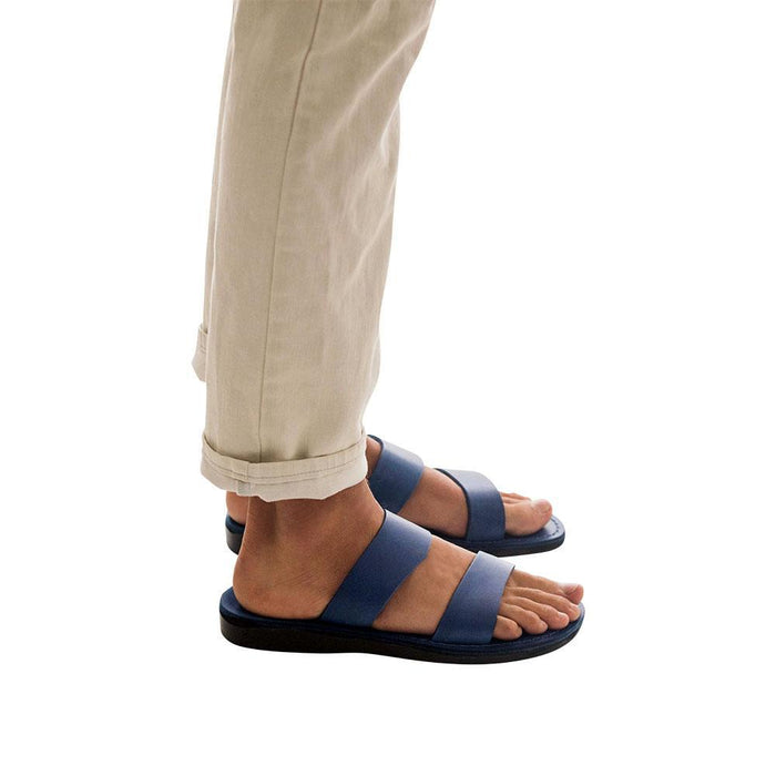 Model wearing Aviv blue, handmade leather slide sandals