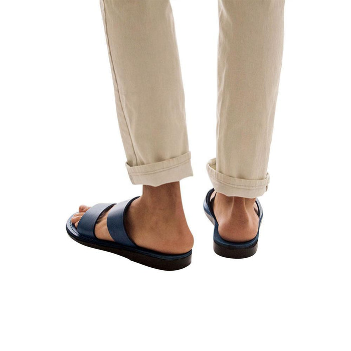 Model wearing Aviv blue, handmade leather slide sandals
