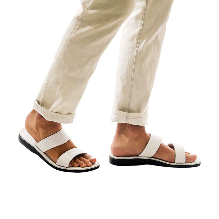 Model wearing Aviv white, handmade leather slide sandals