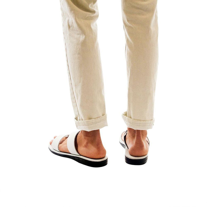 Model wearing Aviv white, handmade leather slide sandals