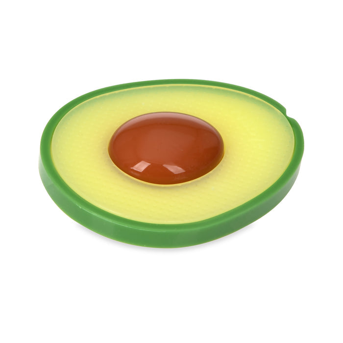 The Avocado Silicone Teether is shaped like a halved avocado with a green edge, yellow center, and raised brown pit. Made from silicone, it features textured areas designed to soothe babies' gums.