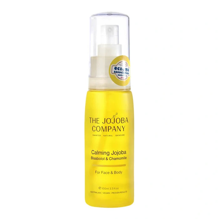 Yellow bottle of The Jojoba Company Calming Jojoba with bisabolol & chamomile on a white background