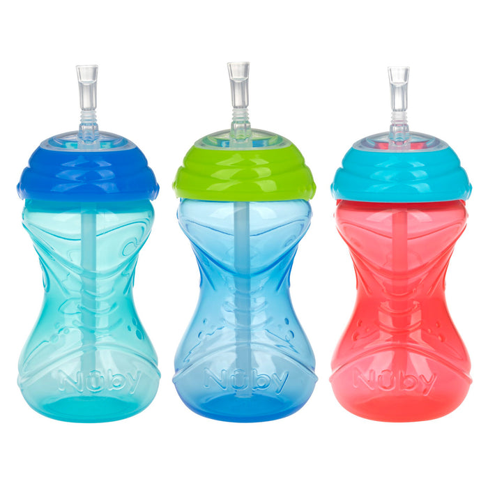 Three Nuby Clik-It Flex Straw Leakproof Sippy Cups (3 Pack) are shown side by side in light blue, blue with a green lid, and red with a blue lid on a white background. Each cup features a soft silicone spout for easy sipping.
