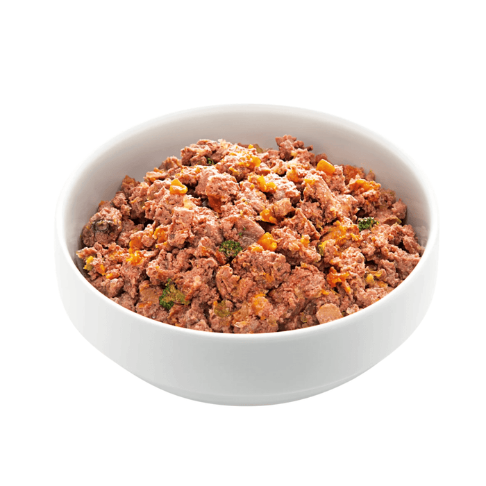 White background with a white bowl of Edgard and Cooper wet puppy food pictured.