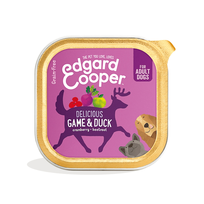 White background with a tray of Edgard and Cooper wet dog food pictured. Text on the foil of the tray says 'Bio Organic, Delicious Game & Duck, Cranberry, Beetroot.'