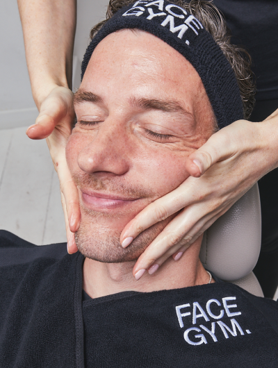 a man getting a facial massage