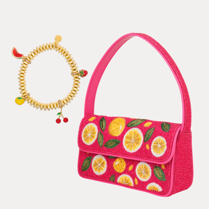 a pink purse with fruit designs
