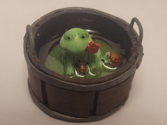Frog in Wooden Bucket with Water and Turtles