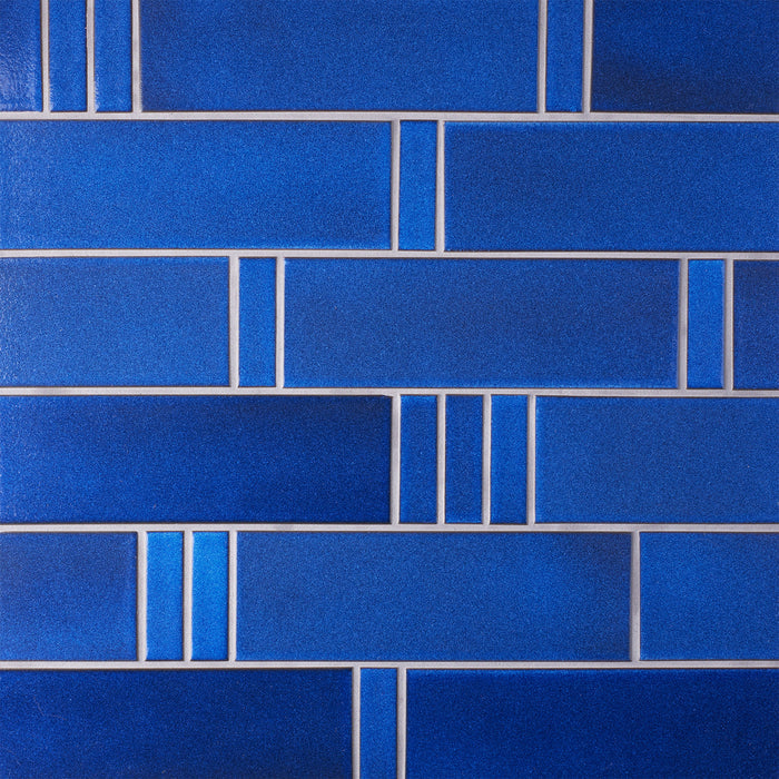 Caption: Classic Field 1x3 & 3x9 in G22 Opal Blue. Prism Pewter grout by Custom Building Products.