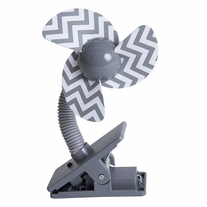 The Grey Stroller Fan is a compact, gray clip-on fan with three blades featuring a white and gray zigzag design, a flexible neck, and sturdy clip base—ideal for use as a baby stroller accessory.