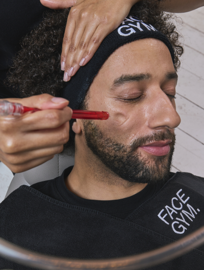 a man getting a facial massage