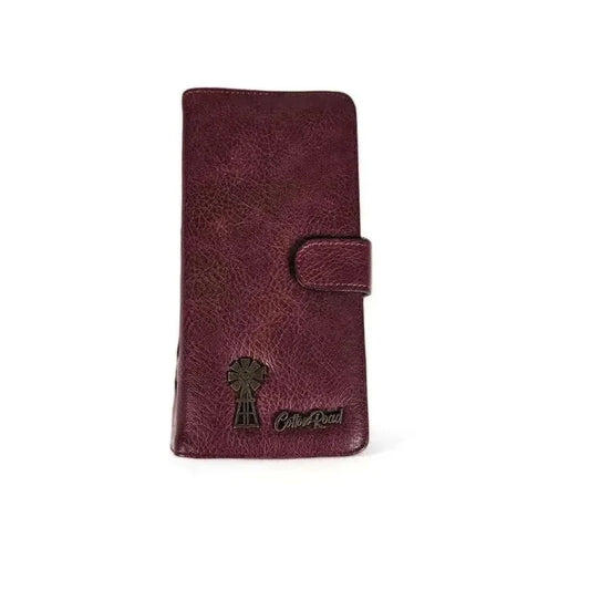 Large maroon wallet with bronze metal windmill, zip compartment, cardholders, and clip closure in PU leather