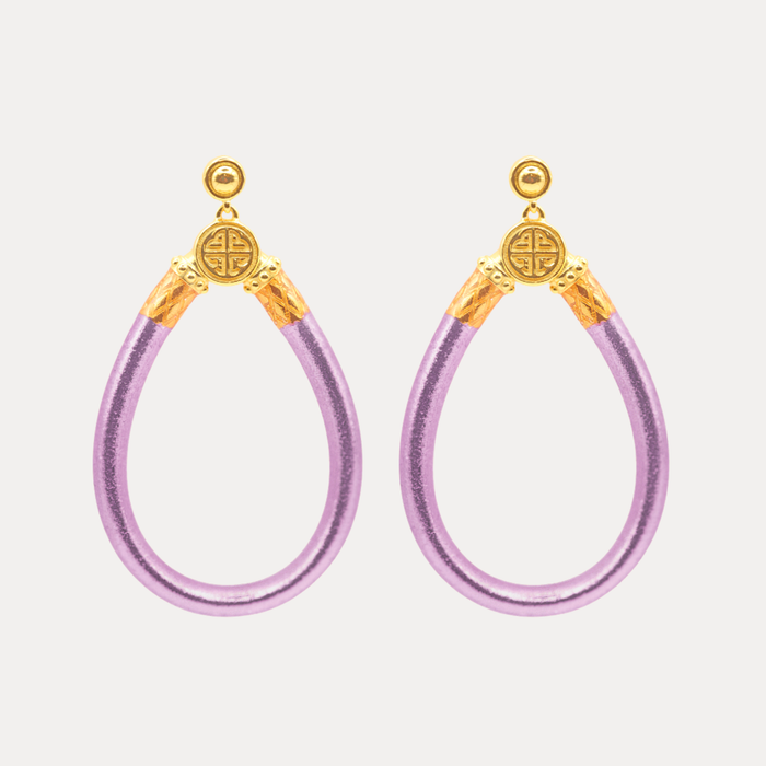 a pair of purple and gold earrings