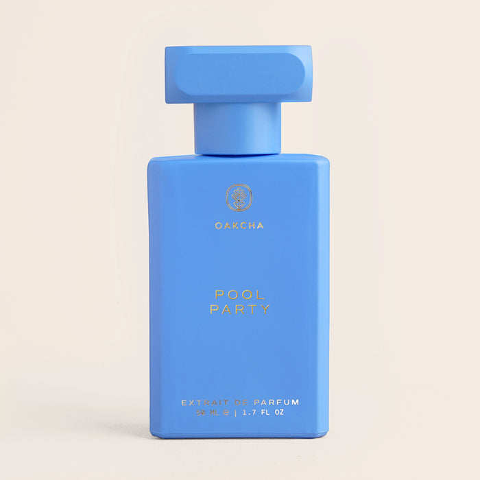 Front view of Pool Party perfume bottle showcasing bright blue rectangular bottle with T-shaped cap on a light beige background