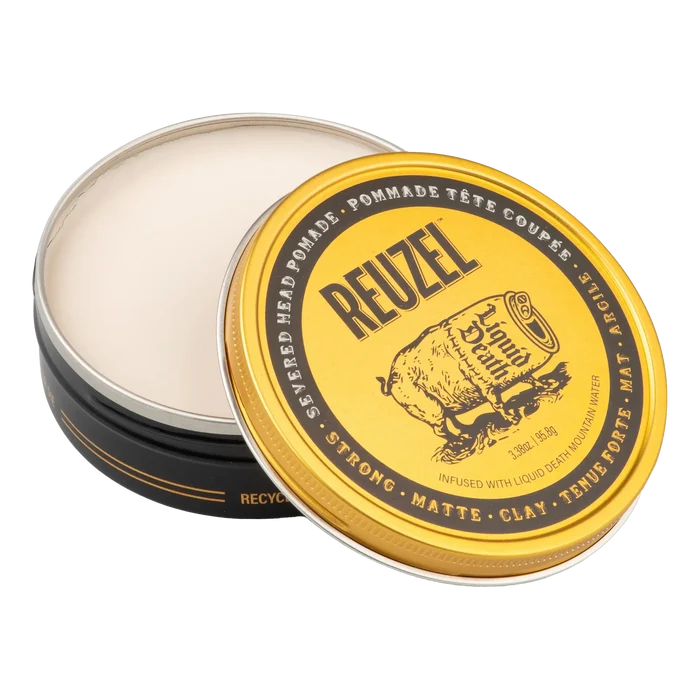 Åpen Reuzel Severed Head pomade-boks med hvit matte leire og gullfarget lokk med produktinformasjon