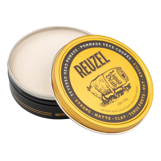 Åpen Reuzel Severed Head pomade-boks med hvit matte leire og gullfarget lokk med produktinformasjon