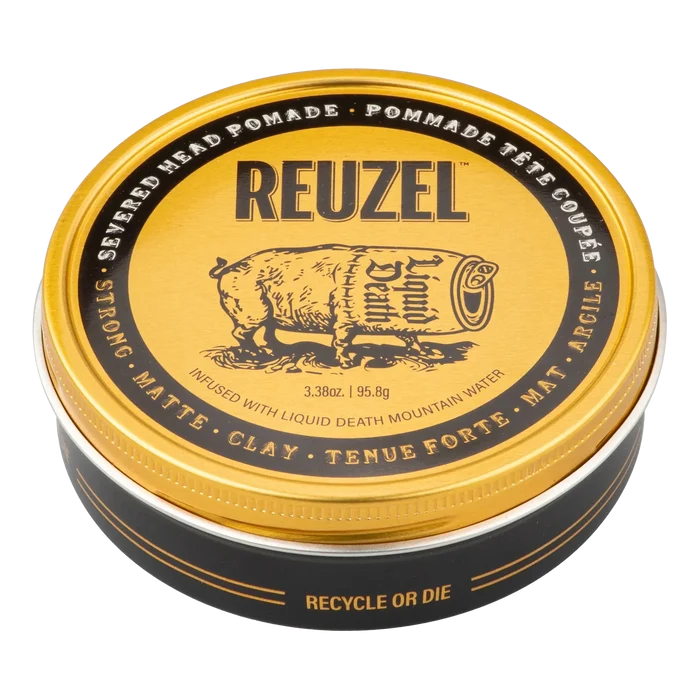 Gullfarget Reuzel Severed Head pomade-boks med åpen lokk, Liquid Death-merking og 95.8g vektangivelse