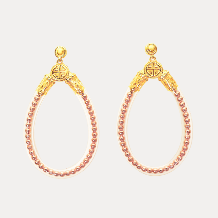 a pair of gold earrings