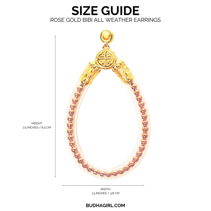 a gold and silver earring with a gold and pink bead