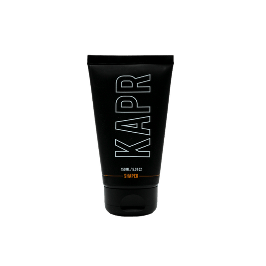 KAPR Shaper – zwarte tube met wit logo op transparante achtergrond, flexibele hairstyling paste.