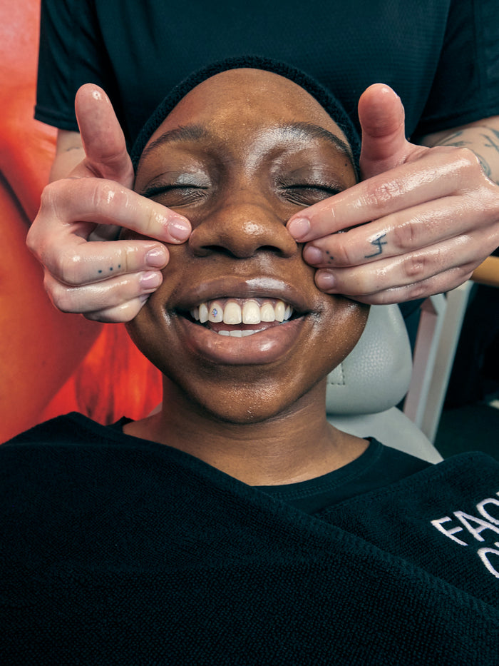 a woman getting a facial massage