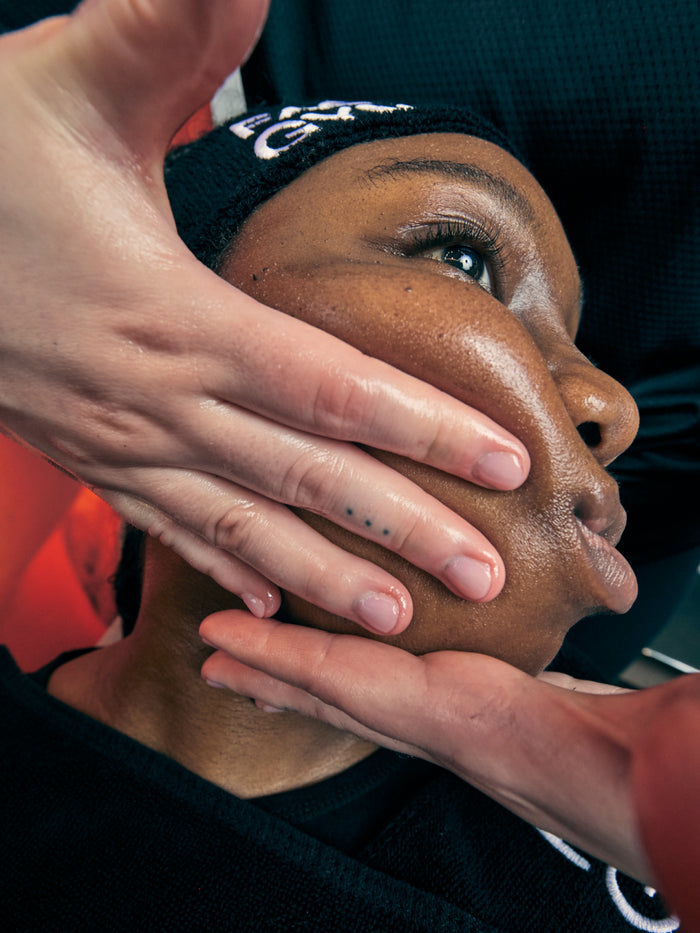 a person touching a woman's face