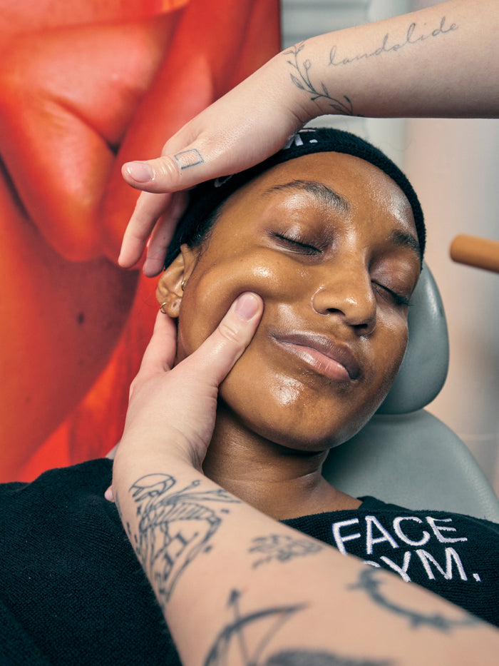 a woman getting a face massage