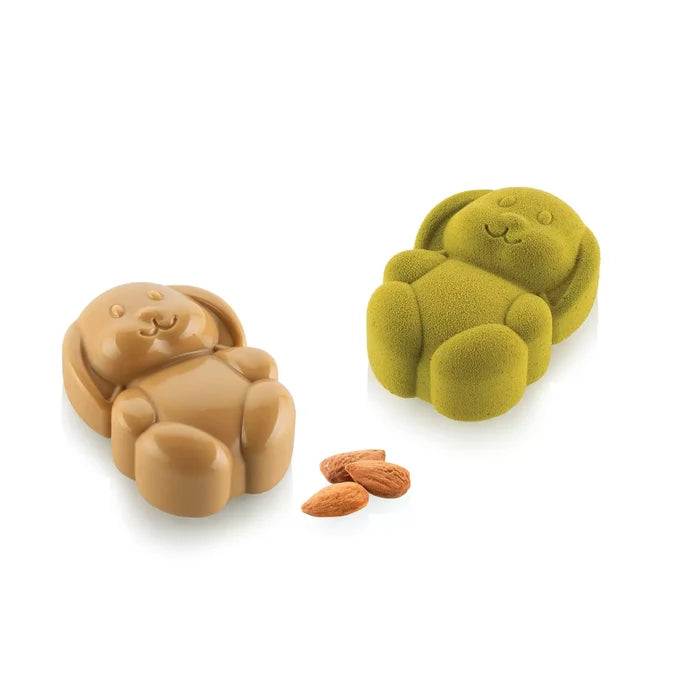 Two rabbit shaped molds, one green and one brown, on a white background.