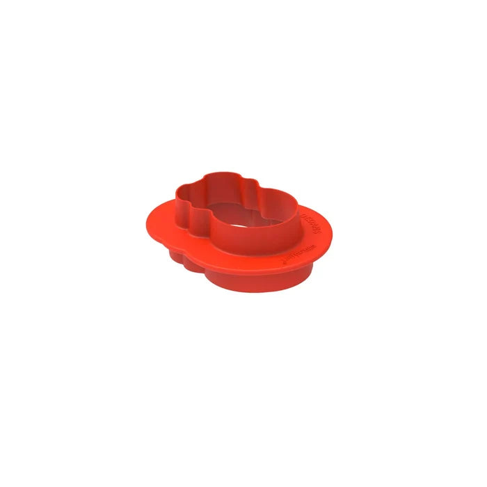 Red plastic component on a white background