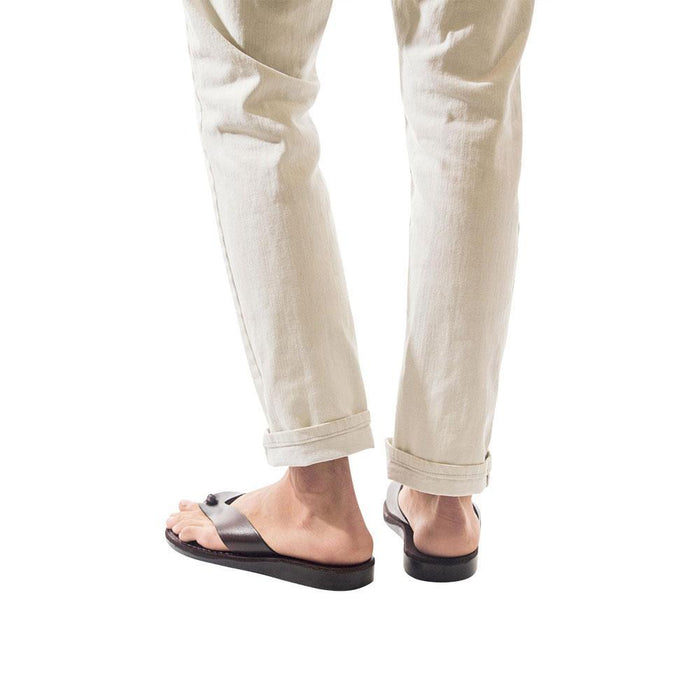 Model wearing Solomon brown, handmade leather slide sandals