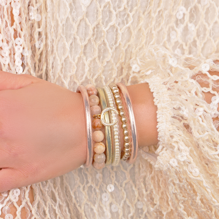 a person wearing bracelets on their wrist
