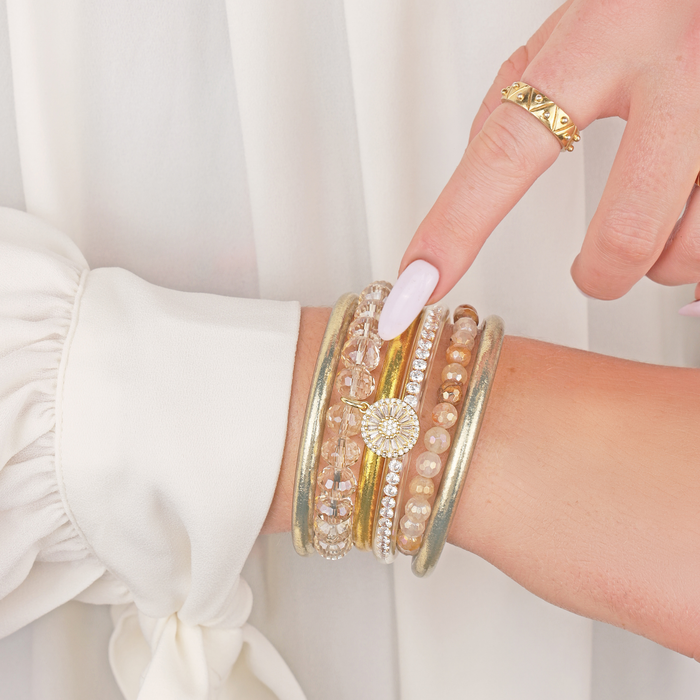 a person wearing gold jewelry