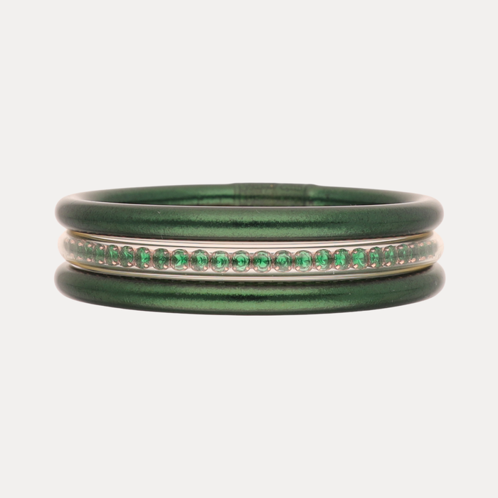a green and silver bracelet with green and gold band
