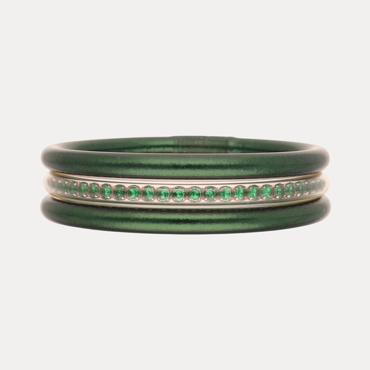 a green and silver bracelet with green and gold band