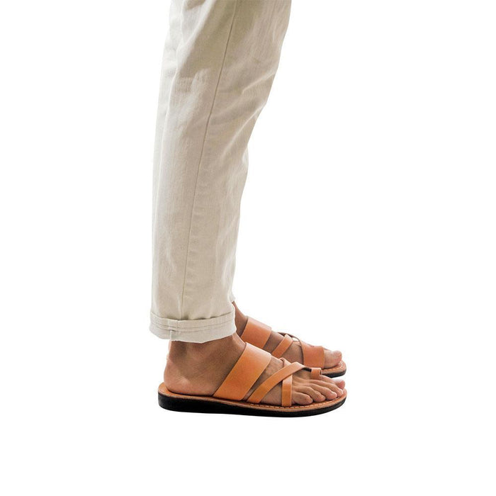 Model wearing The Good Shepherd tan, handmade leather slide sandals with toe loop