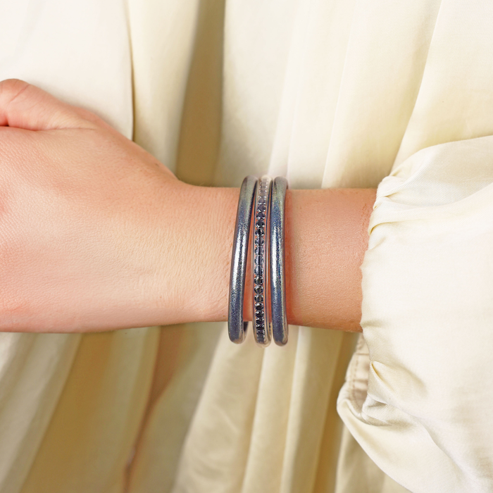 a person wearing bracelets on their wrist
