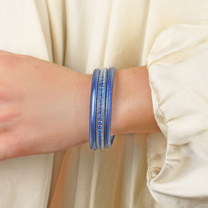 a person wearing a blue bracelet