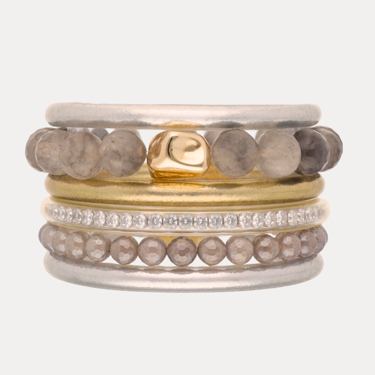 a stack of rings with stones
